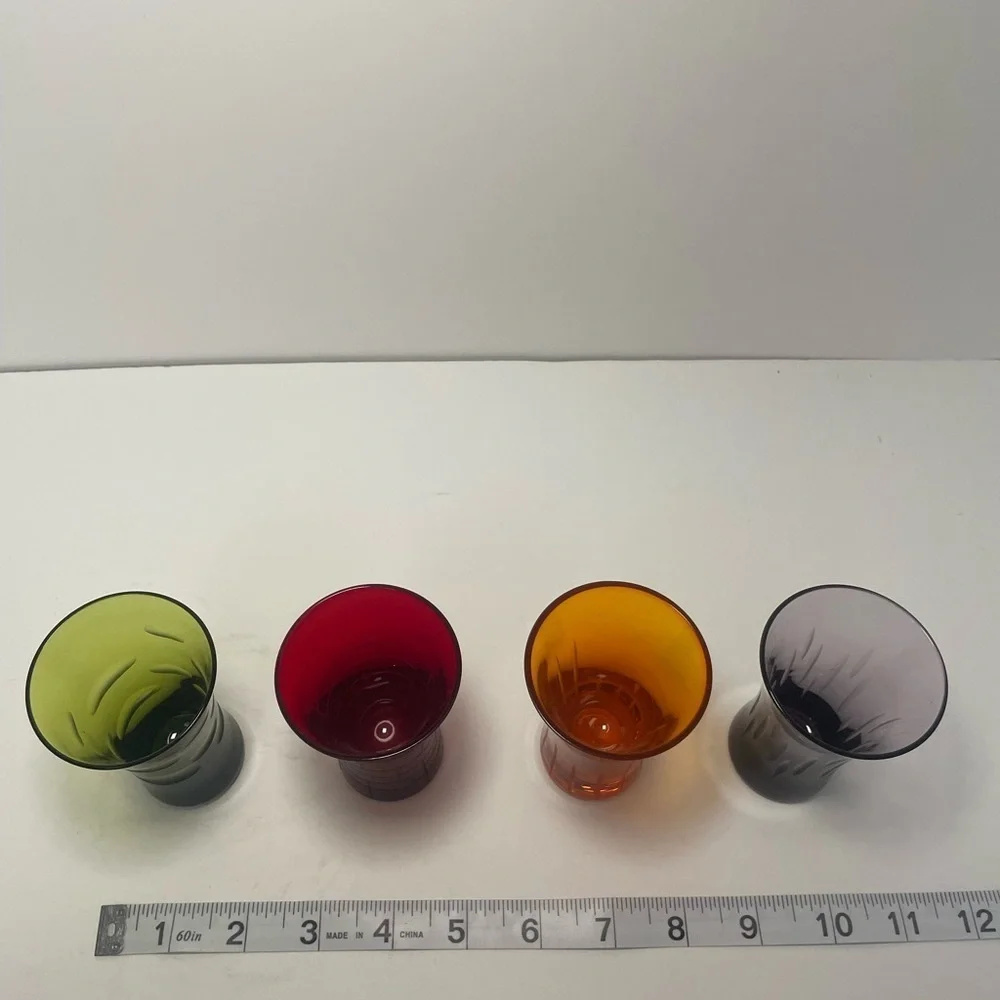 Vintage patterned multicolored shooter glasses.
